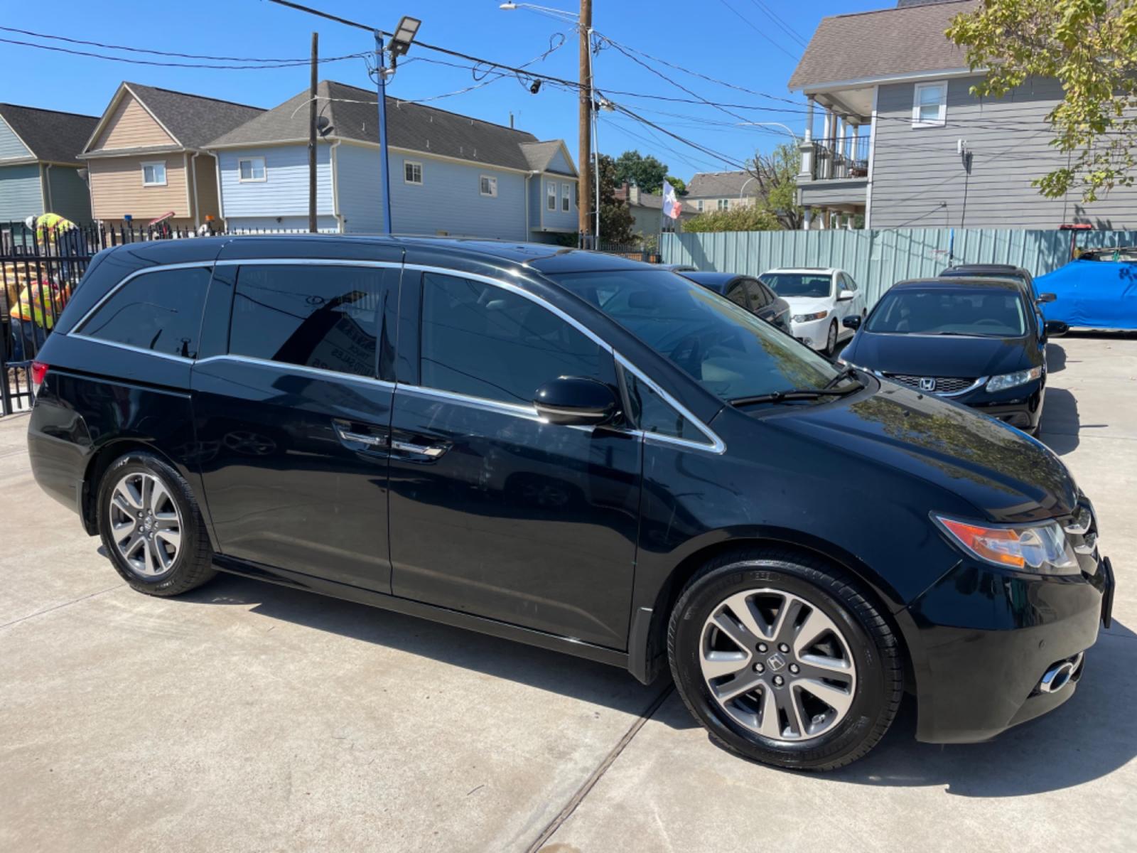 2015 Black /Gray Honda Odyssey Touring (5FNRL5H96FB) with an 3.5L V6 SOHC 24V engine, 6-Speed Automatic transmission, located at 1501 West 15th St., Houston, 77008, (713) 869-2925, 29.797941, -95.411789 - Photo #1