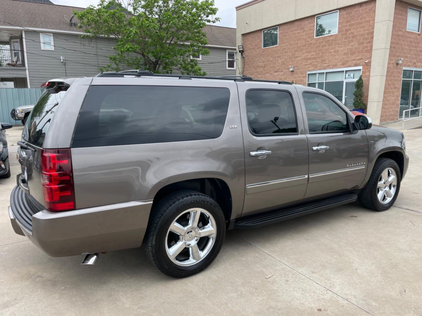 2014 Brown /Beige Chevrolet Suburban LTZ (1GNSCKE04ER) with an 5.3L V8 OHV 16V FFV engine, 6-Speed Automatic transmission, located at 1501 West 15th St., Houston, 77008, (713) 869-2925, 29.797941, -95.411789 - Photo#2