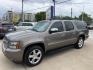 2014 Brown /Beige Chevrolet Suburban LTZ (1GNSCKE04ER) with an 5.3L V8 OHV 16V FFV engine, 6-Speed Automatic transmission, located at 1501 West 15th St., Houston, 77008, (713) 869-2925, 29.797941, -95.411789 - Photo#0