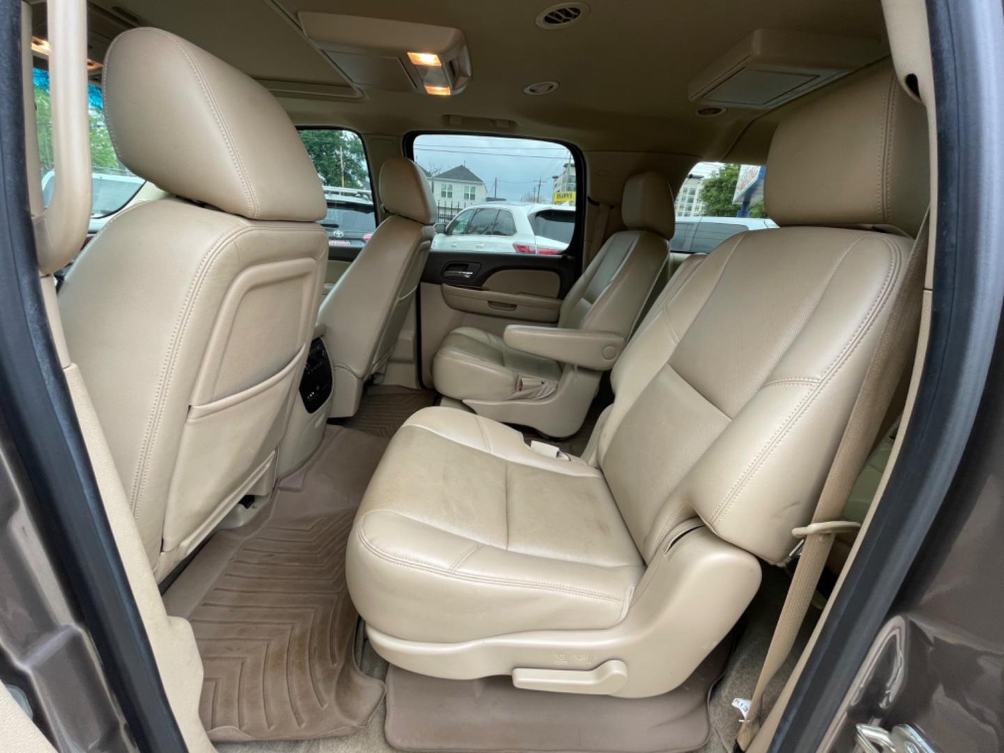 2014 Brown /Beige Chevrolet Suburban LTZ (1GNSCKE04ER) with an 5.3L V8 OHV 16V FFV engine, 6-Speed Automatic transmission, located at 1501 West 15th St., Houston, 77008, (713) 869-2925, 29.797941, -95.411789 - Photo#5