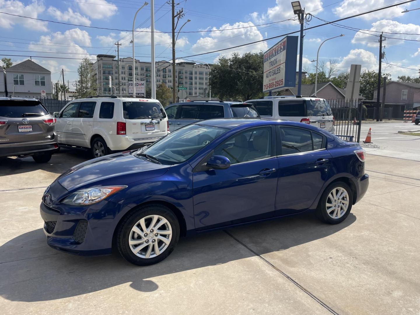 2012 Blue /Beige Mazda MAZDA3 i Touring 4-Door (JM1BL1VF1C1) with an 2.0L L4 DOHC 16V engine, Auto transmission, located at 1501 West 15th St., Houston, 77008, (713) 869-2925, 29.797941, -95.411789 - Photo#0