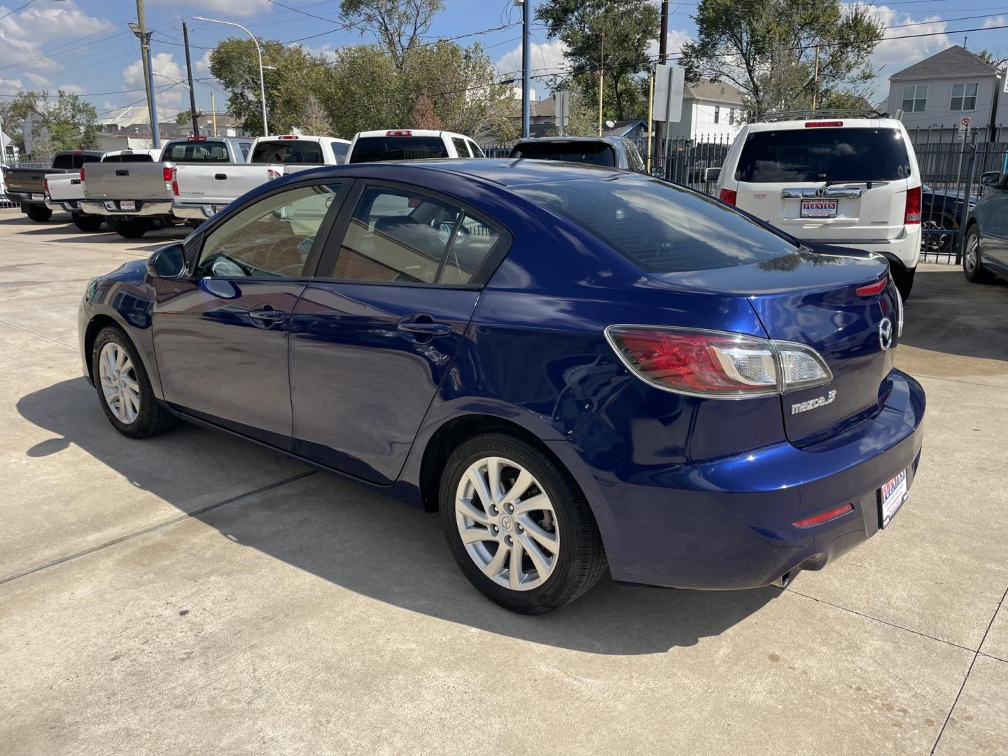 2012 Blue /Beige Mazda MAZDA3 i Touring 4-Door (JM1BL1VF1C1) with an 2.0L L4 DOHC 16V engine, Auto transmission, located at 1501 West 15th St., Houston, 77008, (713) 869-2925, 29.797941, -95.411789 - Photo#3