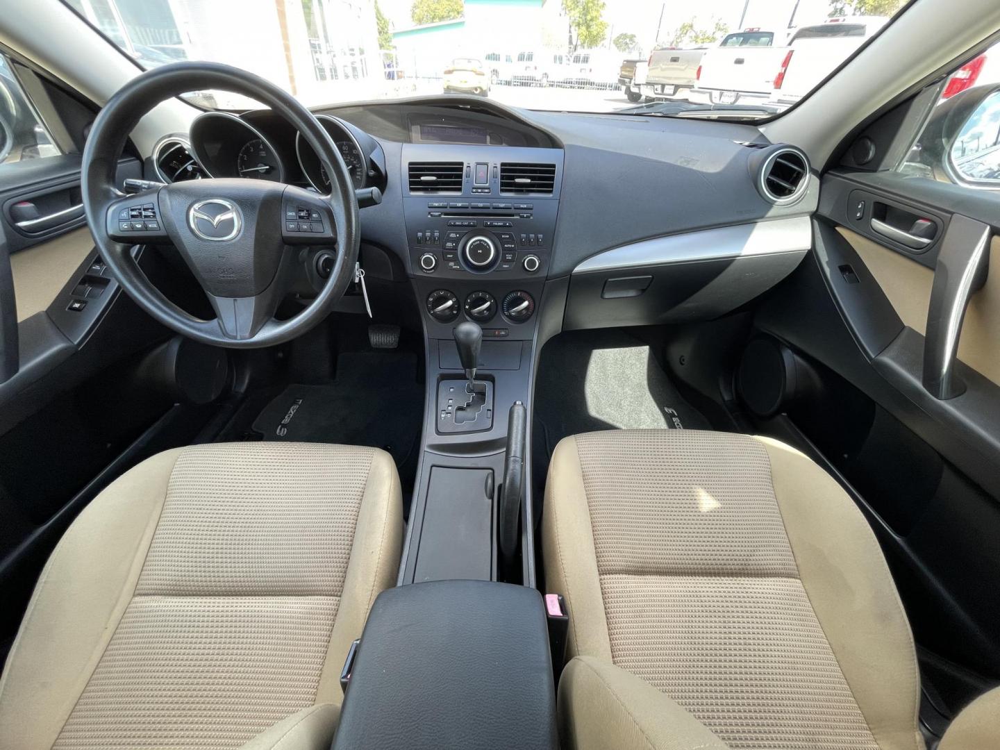 2012 Blue /Beige Mazda MAZDA3 i Touring 4-Door (JM1BL1VF1C1) with an 2.0L L4 DOHC 16V engine, Auto transmission, located at 1501 West 15th St., Houston, 77008, (713) 869-2925, 29.797941, -95.411789 - Photo#7