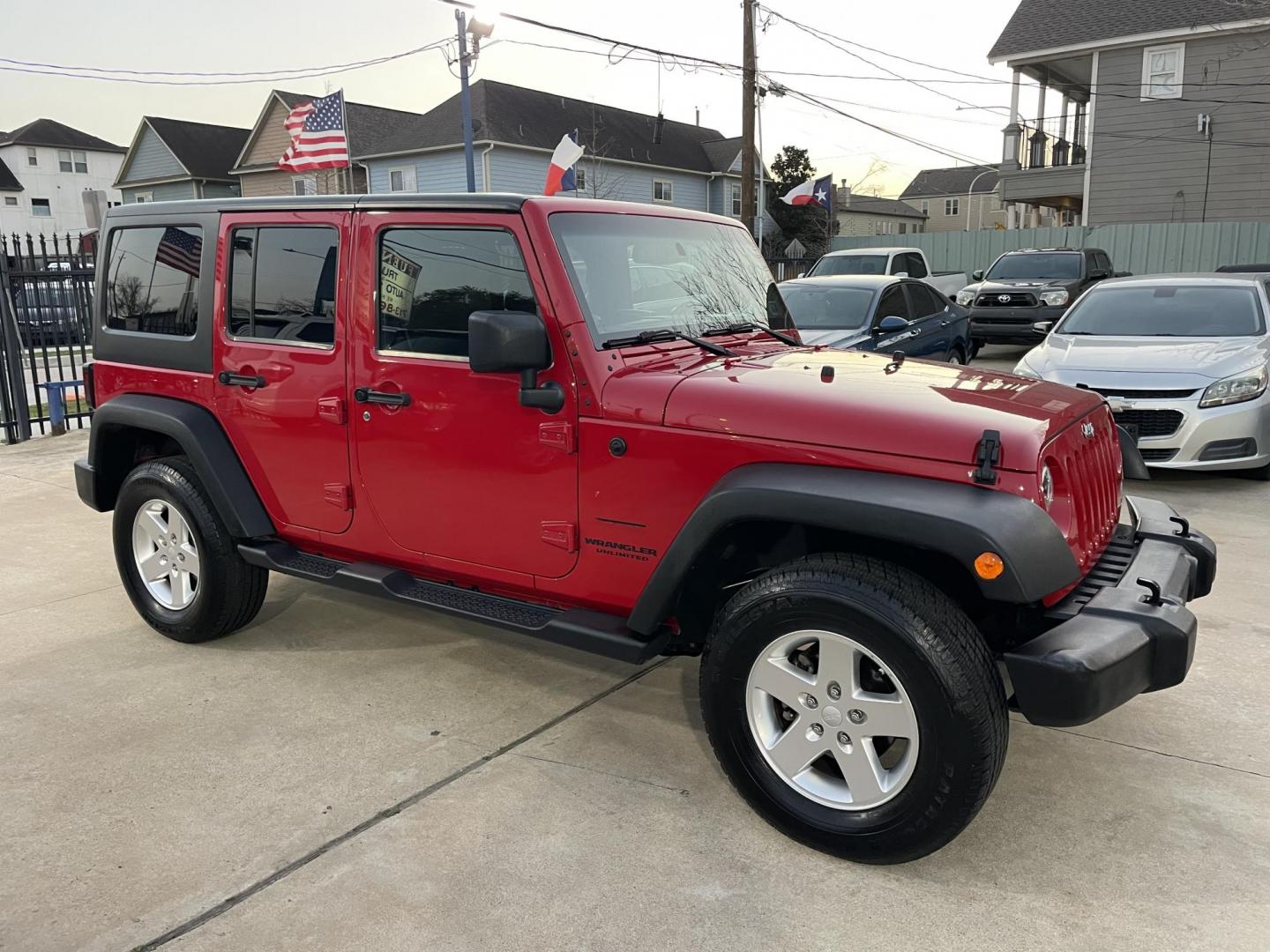 2014 Red /Black Jeep Wrangler Unlimited Sport 4WD (1C4HJWDG7EL) with an 3.6L V6 DOHC 24V FFV engine, Automatic transmission, located at 1501 West 15th St., Houston, 77008, (713) 869-2925, 29.797941, -95.411789 - Photo#1