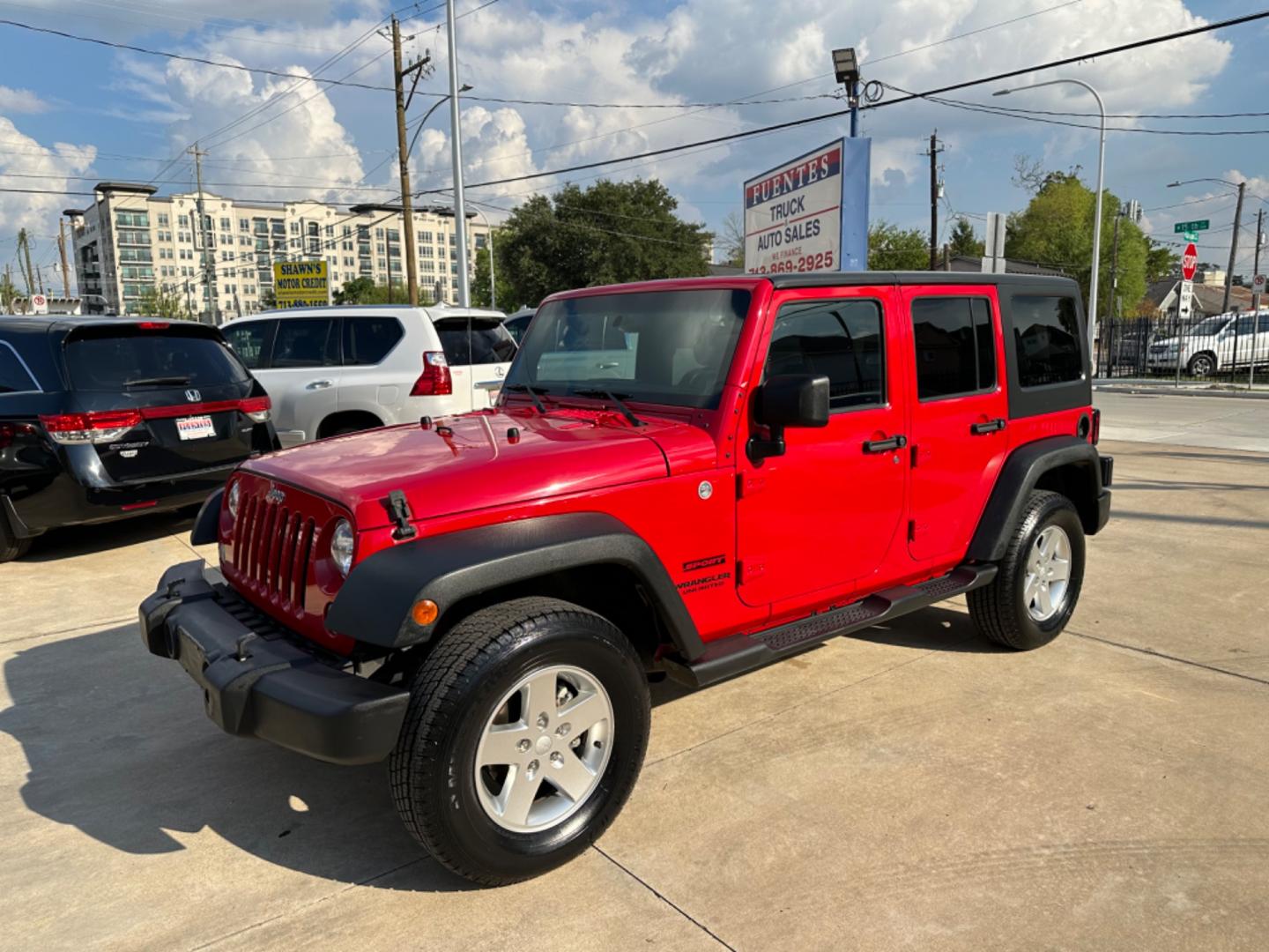 2014 Red /Black Jeep Wrangler Unlimited Sport 4WD (1C4HJWDG7EL) with an 3.6L V6 DOHC 24V FFV engine, Automatic transmission, located at 1501 West 15th St., Houston, 77008, (713) 869-2925, 29.797941, -95.411789 - Photo#0