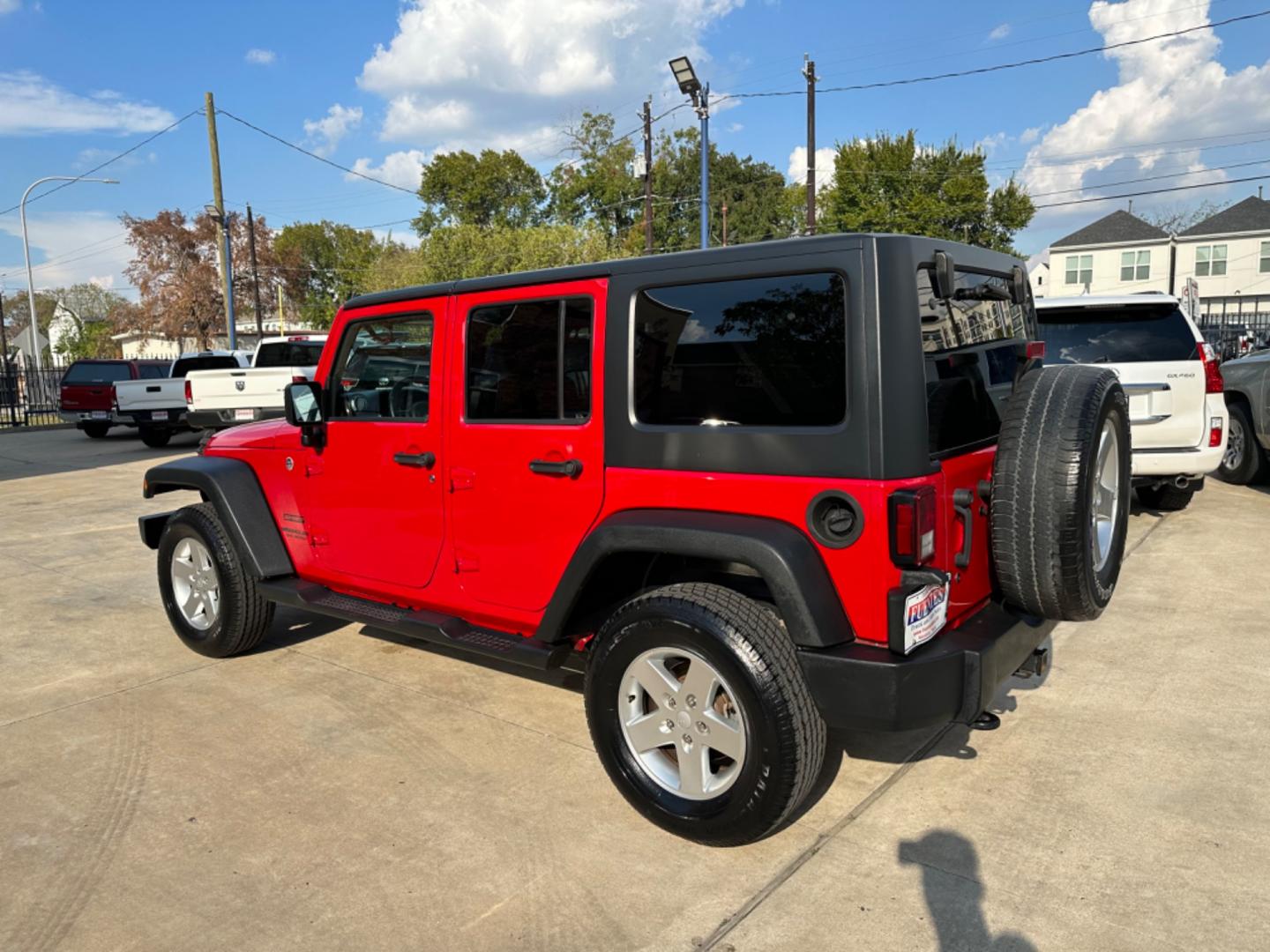 2014 Red /Black Jeep Wrangler Unlimited Sport 4WD (1C4HJWDG7EL) with an 3.6L V6 DOHC 24V FFV engine, Automatic transmission, located at 1501 West 15th St., Houston, 77008, (713) 869-2925, 29.797941, -95.411789 - Photo#3