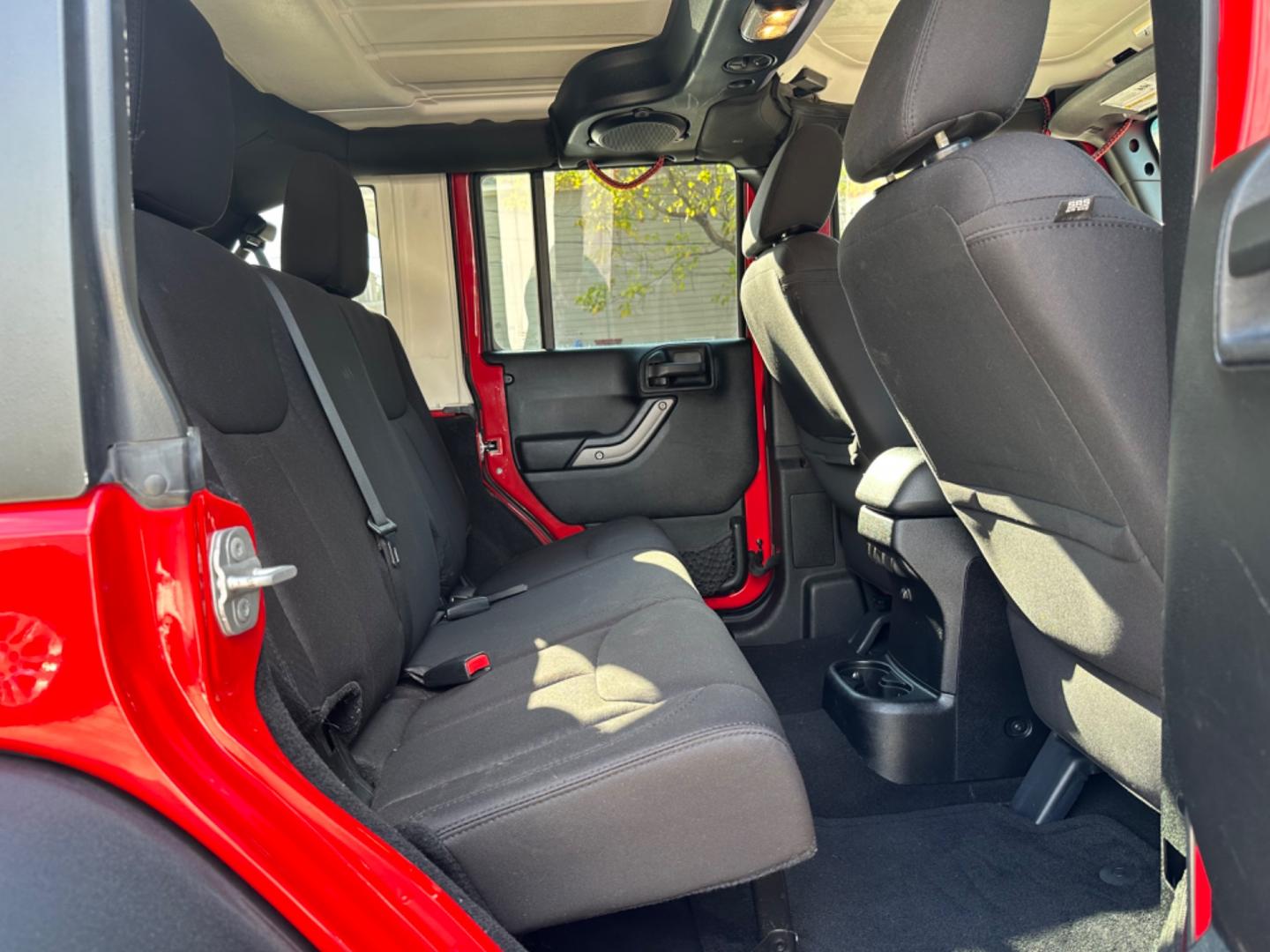 2014 Red /Black Jeep Wrangler Unlimited Sport 4WD (1C4HJWDG7EL) with an 3.6L V6 DOHC 24V FFV engine, Automatic transmission, located at 1501 West 15th St., Houston, 77008, (713) 869-2925, 29.797941, -95.411789 - Photo#5