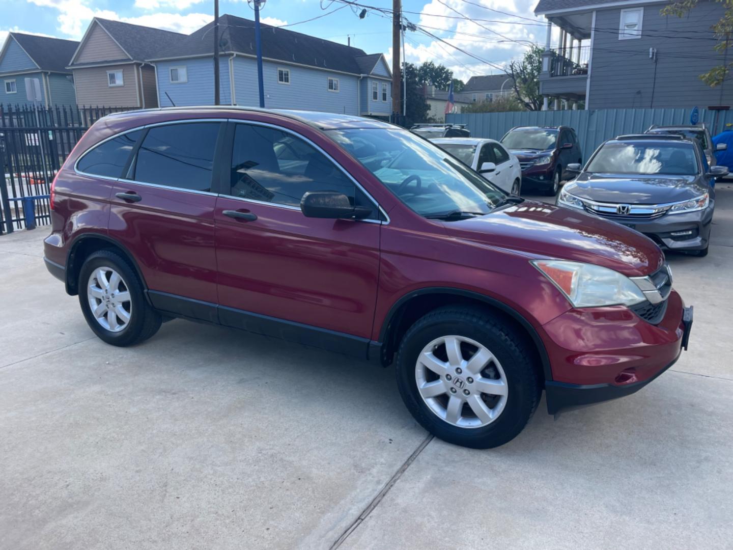 2011 Red /Silver Honda CR-V SE 2WD 5-Speed AT (5J6RE3H43BL) with an 2.4L L4 DOHC 16V engine, 5-Speed Automatic transmission, located at 1501 West 15th St., Houston, 77008, (713) 869-2925, 29.797941, -95.411789 - Photo#1