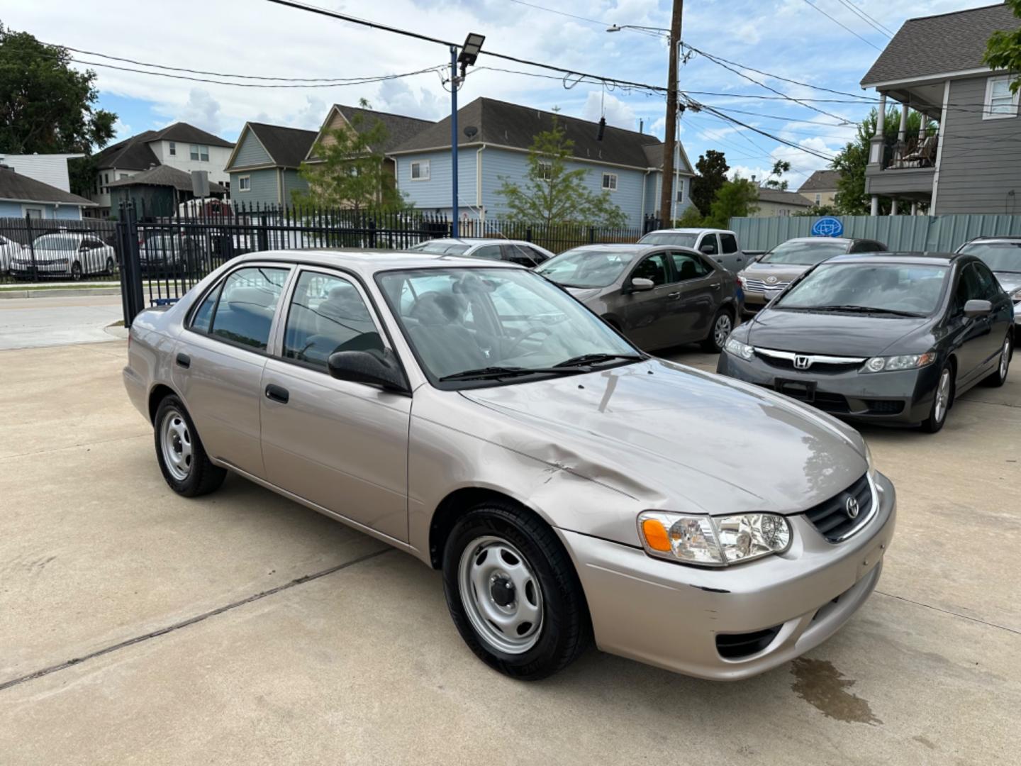 2002 Beige /Beige Toyota Corolla CE (1NXBR12E92Z) with an 1.8L L4 DOHC 16V engine, Automatic transmission, located at 1501 West 15th St., Houston, 77008, (713) 869-2925, 29.797941, -95.411789 - Photo#1