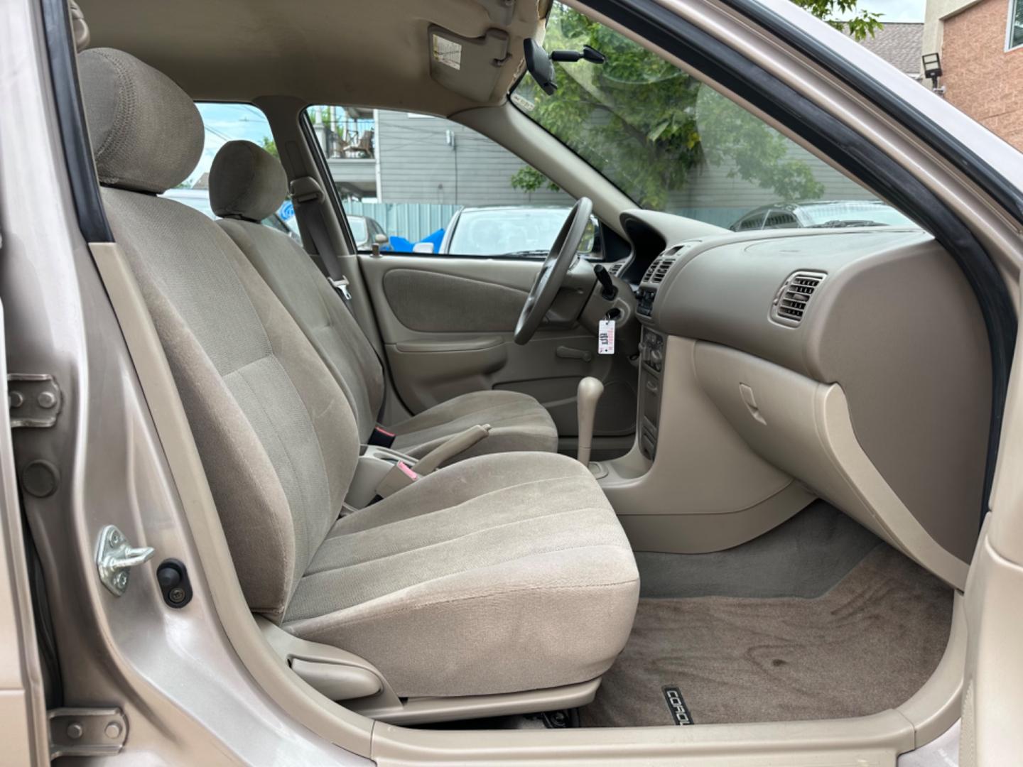 2002 Beige /Beige Toyota Corolla CE (1NXBR12E92Z) with an 1.8L L4 DOHC 16V engine, Automatic transmission, located at 1501 West 15th St., Houston, 77008, (713) 869-2925, 29.797941, -95.411789 - Photo#4