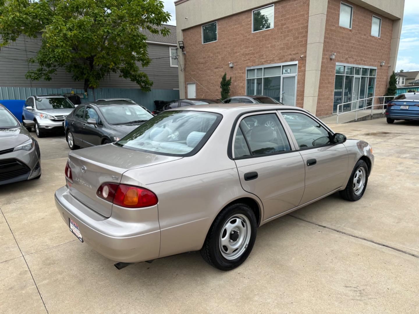 2002 Beige /Beige Toyota Corolla CE (1NXBR12E92Z) with an 1.8L L4 DOHC 16V engine, Automatic transmission, located at 1501 West 15th St., Houston, 77008, (713) 869-2925, 29.797941, -95.411789 - Photo#2