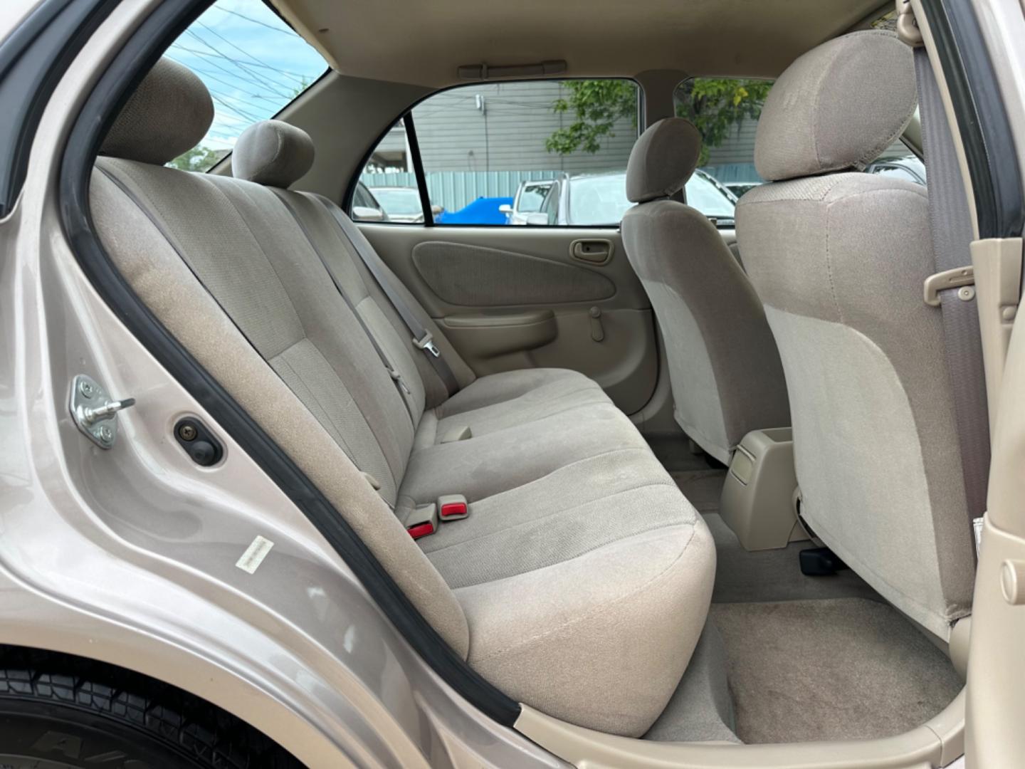 2002 Beige /Beige Toyota Corolla CE (1NXBR12E92Z) with an 1.8L L4 DOHC 16V engine, Automatic transmission, located at 1501 West 15th St., Houston, 77008, (713) 869-2925, 29.797941, -95.411789 - Photo#5