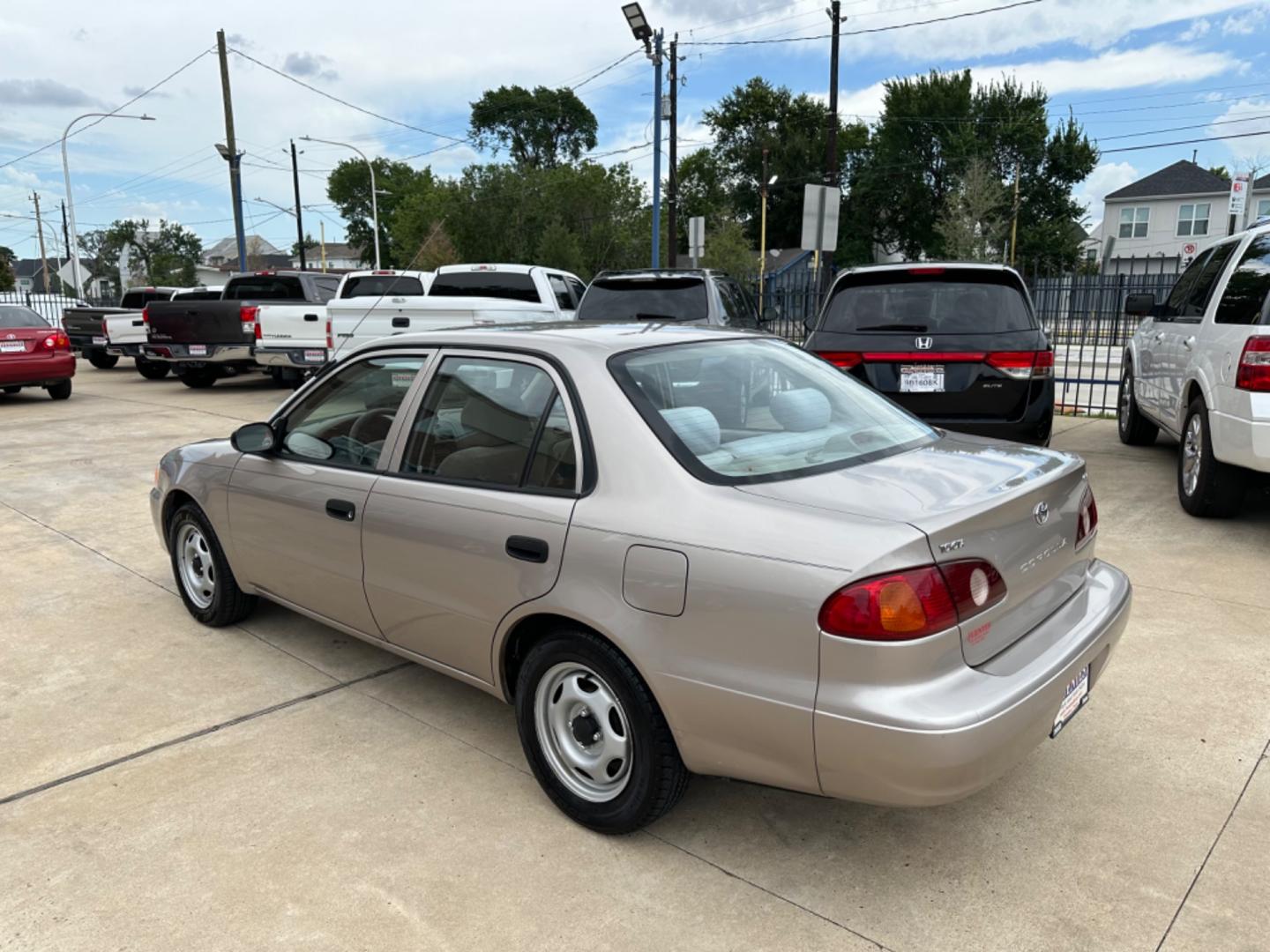 2002 Beige /Beige Toyota Corolla CE (1NXBR12E92Z) with an 1.8L L4 DOHC 16V engine, Automatic transmission, located at 1501 West 15th St., Houston, 77008, (713) 869-2925, 29.797941, -95.411789 - Photo#3