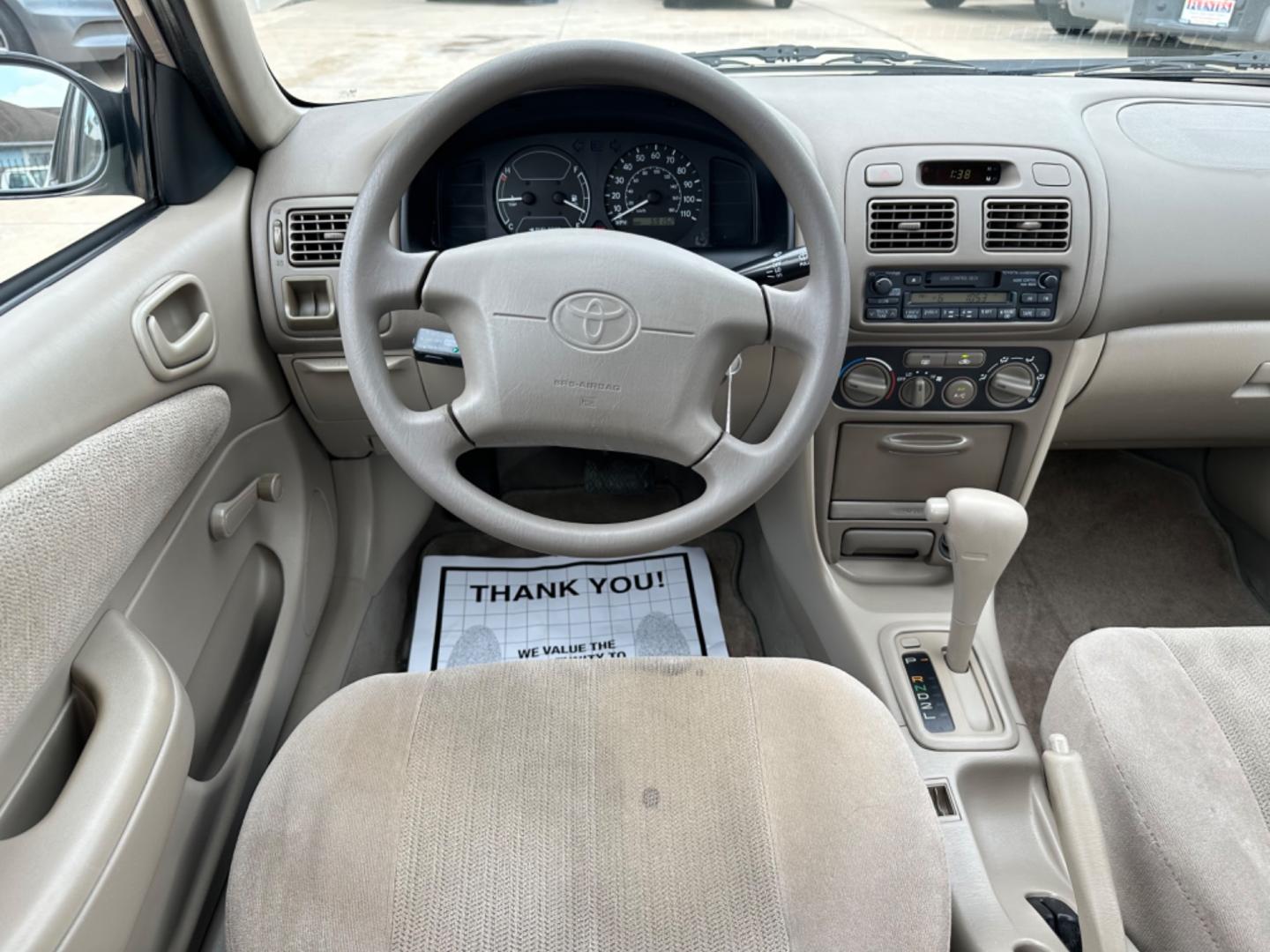 2002 Beige /Beige Toyota Corolla CE (1NXBR12E92Z) with an 1.8L L4 DOHC 16V engine, Automatic transmission, located at 1501 West 15th St., Houston, 77008, (713) 869-2925, 29.797941, -95.411789 - Photo#7