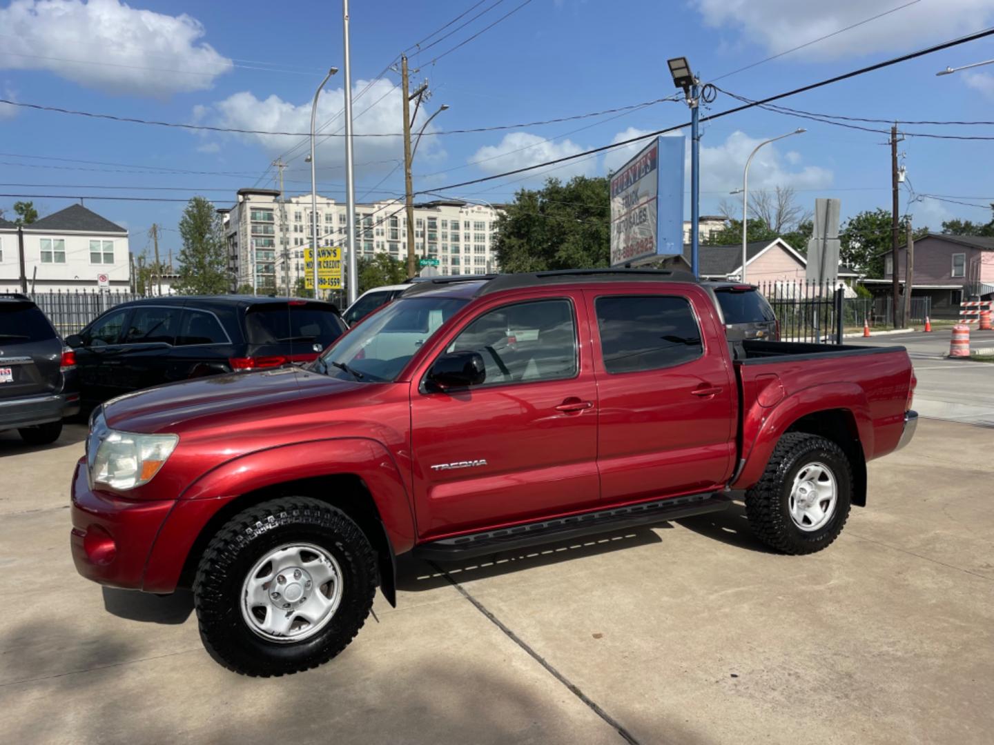 2006 Red /Silver Toyota Tacoma Sr5 (5TEJU62N26Z) with an 4.0L engine, Automatic transmission, located at 1501 West 15th St., Houston, 77008, (713) 869-2925, 29.797941, -95.411789 - Photo#0