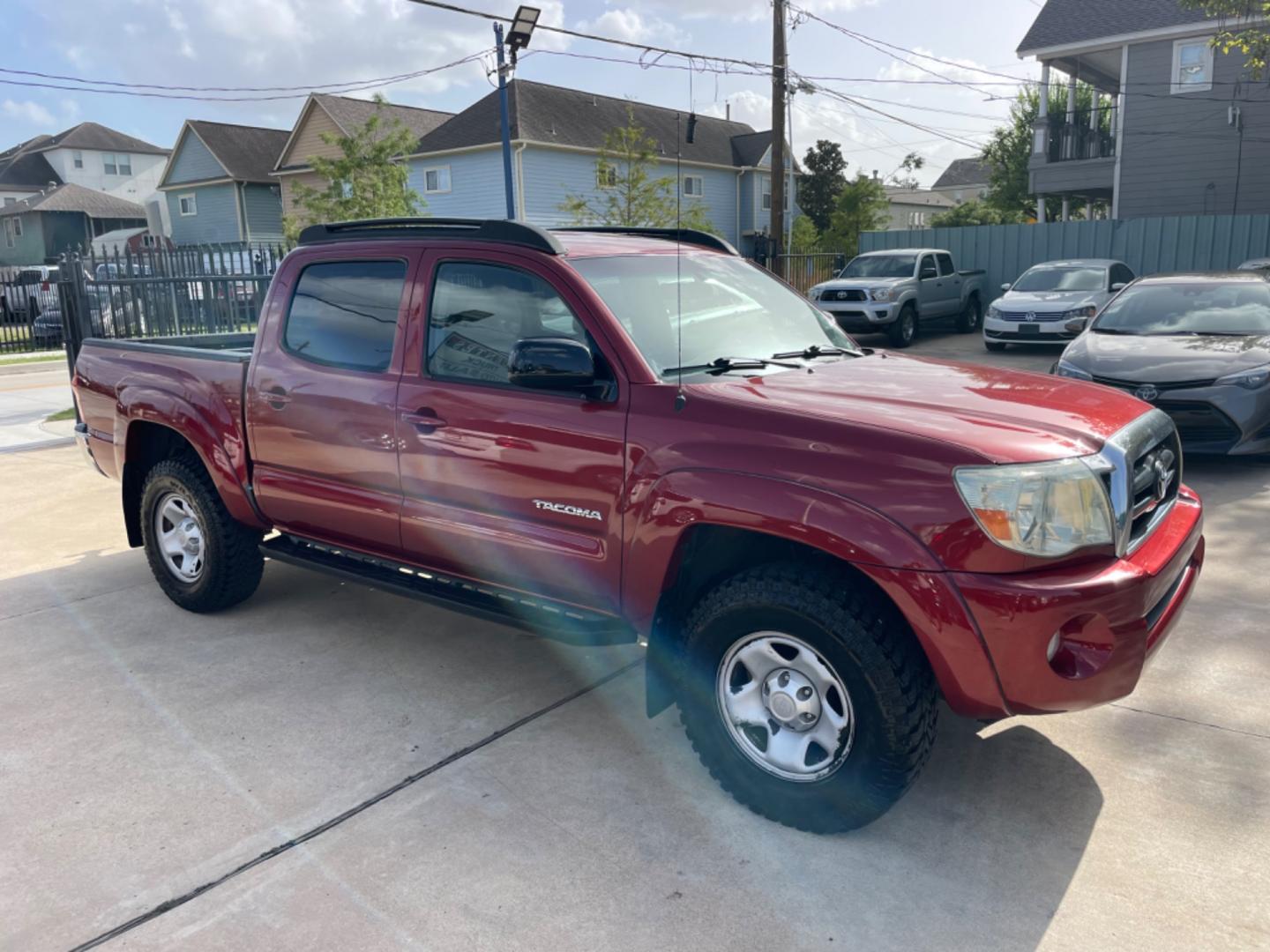 2006 Red /Silver Toyota Tacoma Sr5 (5TEJU62N26Z) with an 4.0L engine, Automatic transmission, located at 1501 West 15th St., Houston, 77008, (713) 869-2925, 29.797941, -95.411789 - Photo#1