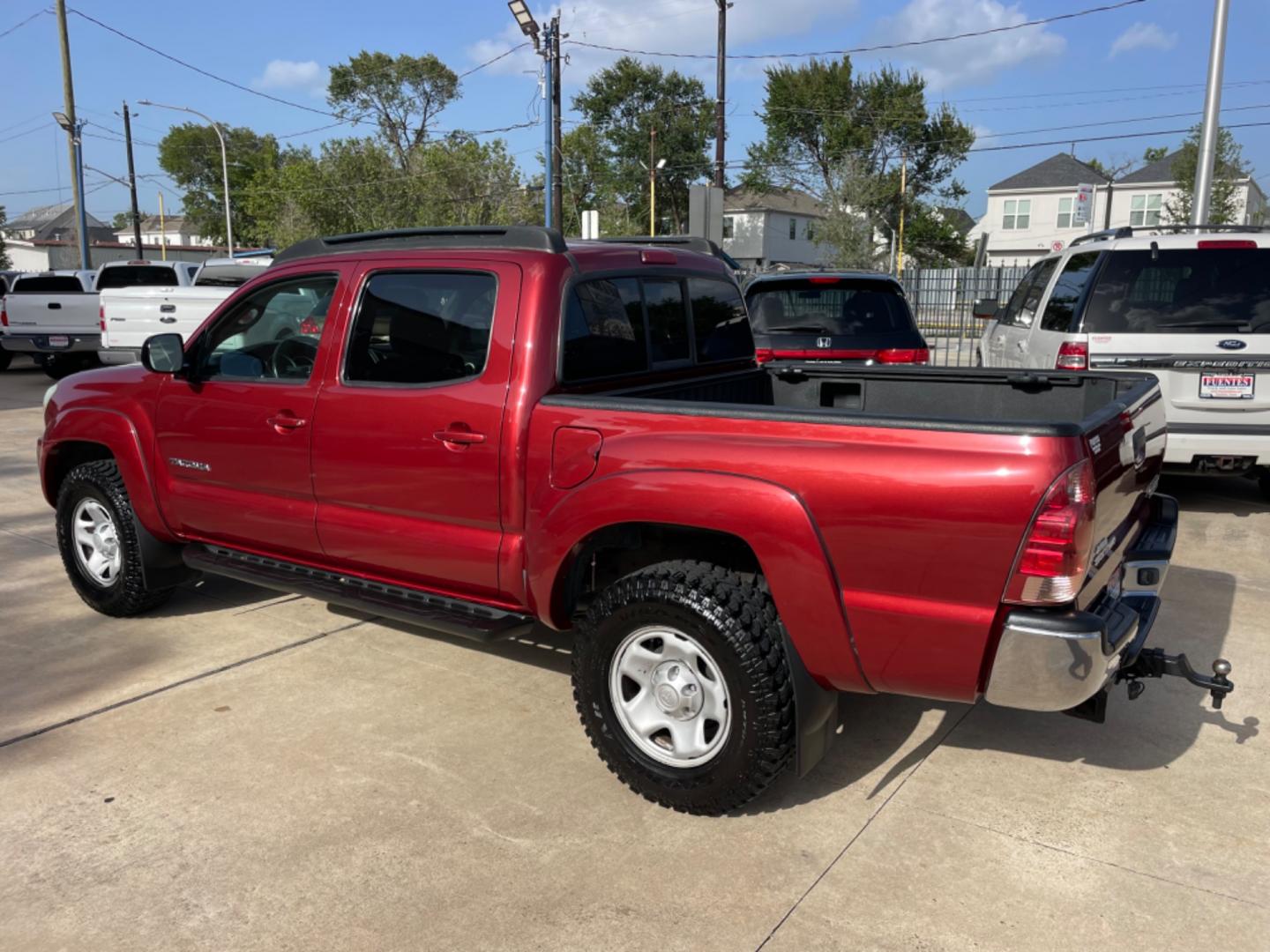 2006 Red /Silver Toyota Tacoma Sr5 (5TEJU62N26Z) with an 4.0L engine, Automatic transmission, located at 1501 West 15th St., Houston, 77008, (713) 869-2925, 29.797941, -95.411789 - Photo#3