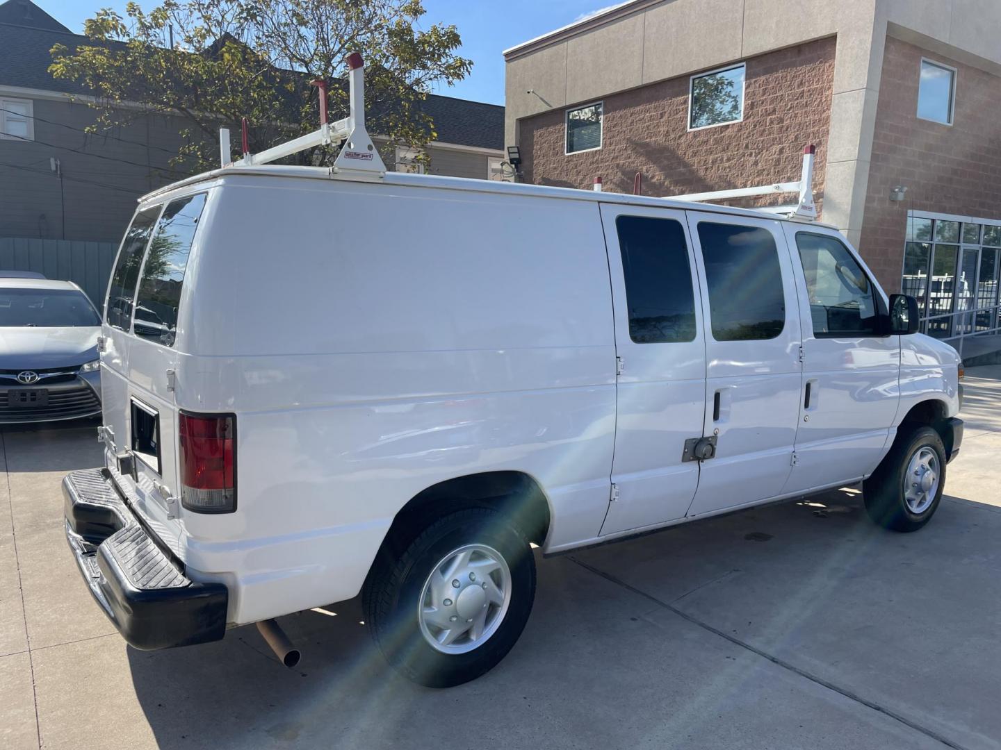 2012 Ford E-Series Van E-150 (1FTNE1EW9CD) with an 4.6L V8 SOHC 16V engine, 4-Speed Automatic transmission, located at 1501 West 15th St., Houston, 77008, (713) 869-2925, 29.797941, -95.411789 - Photo#2