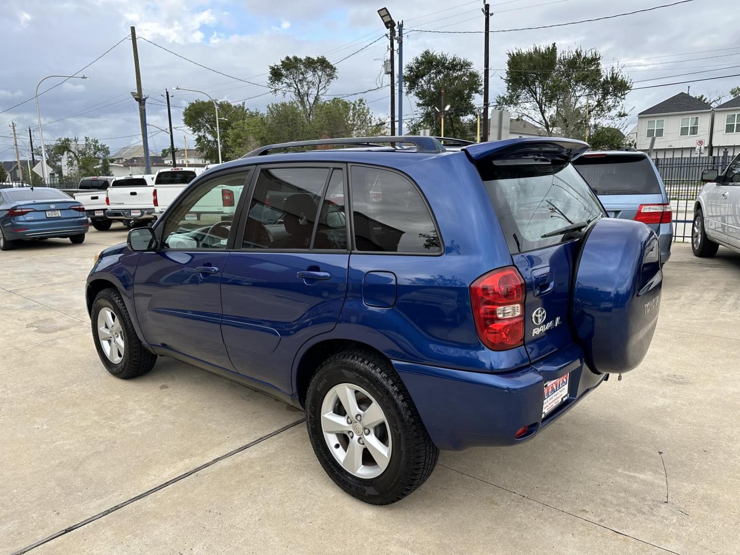 2005 Blue /Silver Toyota RAV4 2WD (JTEGD20V650) with an 2.4L L4 DOHC 16V engine, Automatic transmission, located at 1501 West 15th St., Houston, 77008, (713) 869-2925, 29.797941, -95.411789 - Photo#3