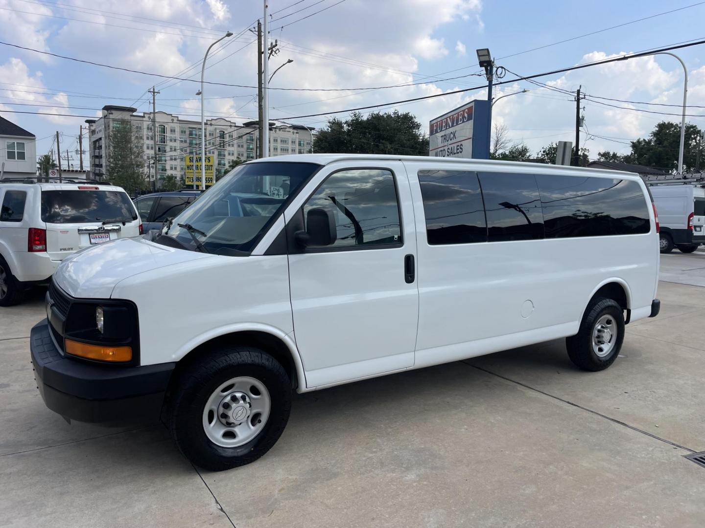 2007 White /Beige Chevrolet Express LS 3500 Extended (1GAHG39U271) with an 6.0L V8 OHV 16V engine, 4-Speed Automatic Overdrive transmission, located at 1501 West 15th St., Houston, 77008, (713) 869-2925, 29.797941, -95.411789 - Photo#0