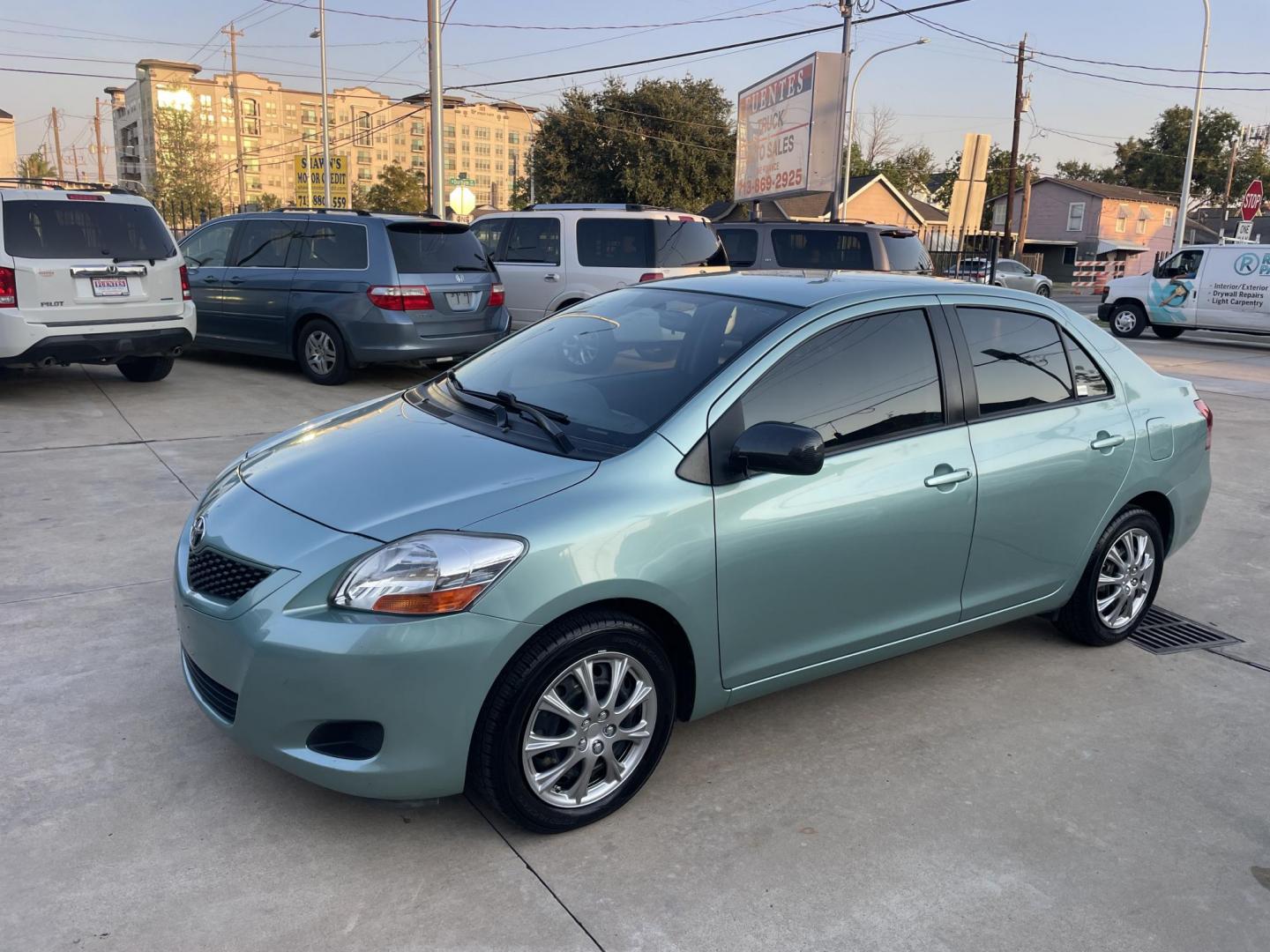 2009 Green /Black Toyota Yaris Sedan 4-Speed AT (JTDBT903694) with an 1.5L L4 DOHC 16V engine, 4-Speed Automatic transmission, located at 1501 West 15th St., Houston, 77008, (713) 869-2925, 29.797941, -95.411789 - Photo#0