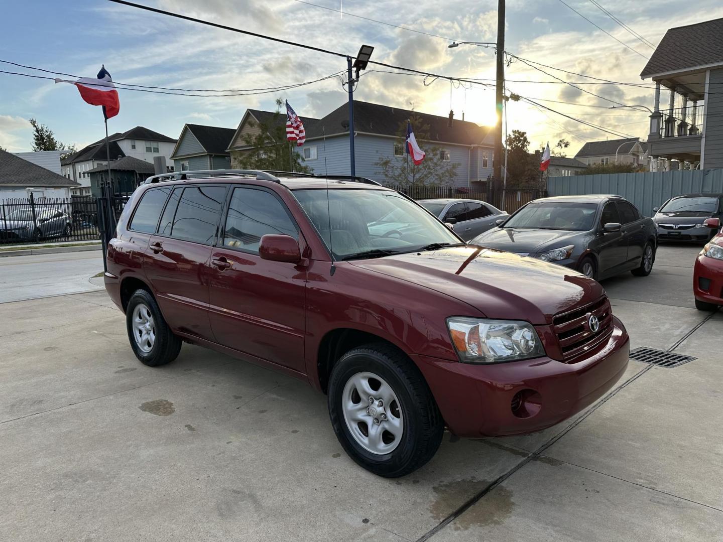 2006 Red /Beige Toyota Highlander 2WD (JTEGD21A060) with an 2.4L L4 DOHC 16V engine, 4-Speed Automatic Overdrive transmission, located at 1501 West 15th St., Houston, 77008, (713) 869-2925, 29.797941, -95.411789 - Photo#1