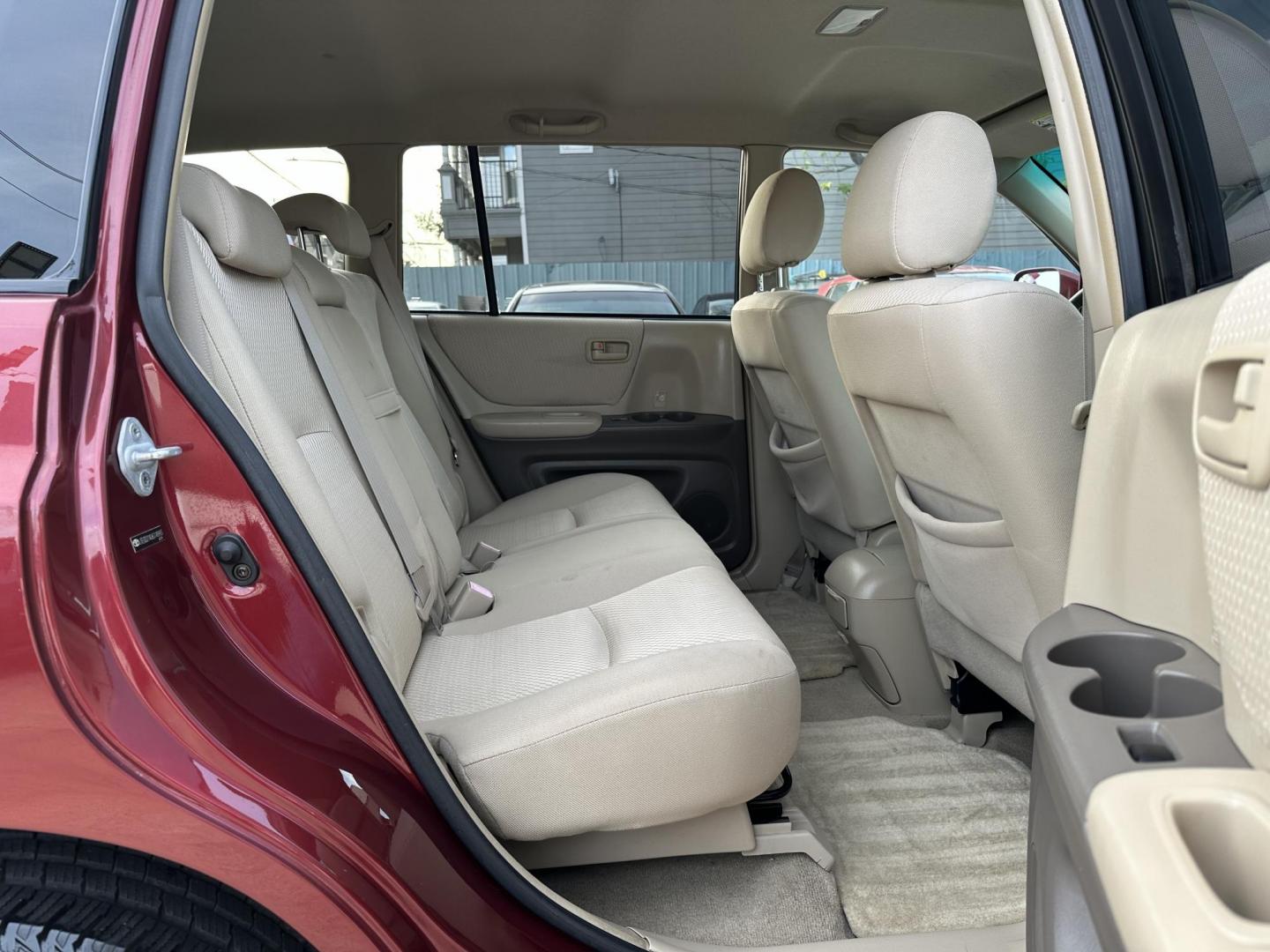 2006 Red /Beige Toyota Highlander 2WD (JTEGD21A060) with an 2.4L L4 DOHC 16V engine, 4-Speed Automatic Overdrive transmission, located at 1501 West 15th St., Houston, 77008, (713) 869-2925, 29.797941, -95.411789 - Photo#6