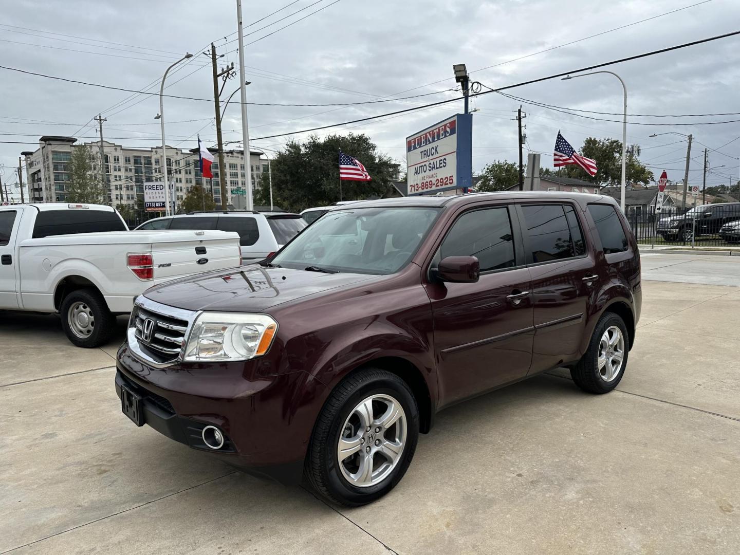 2014 Maroon /Black Honda Pilot EX-L 2WD 5-Spd AT (5FNYF3H58EB) with an 3.5L V6 SOHC 24V engine, 5-Speed Automatic transmission, located at 1501 West 15th St., Houston, 77008, (713) 869-2925, 29.797941, -95.411789 - Photo#0