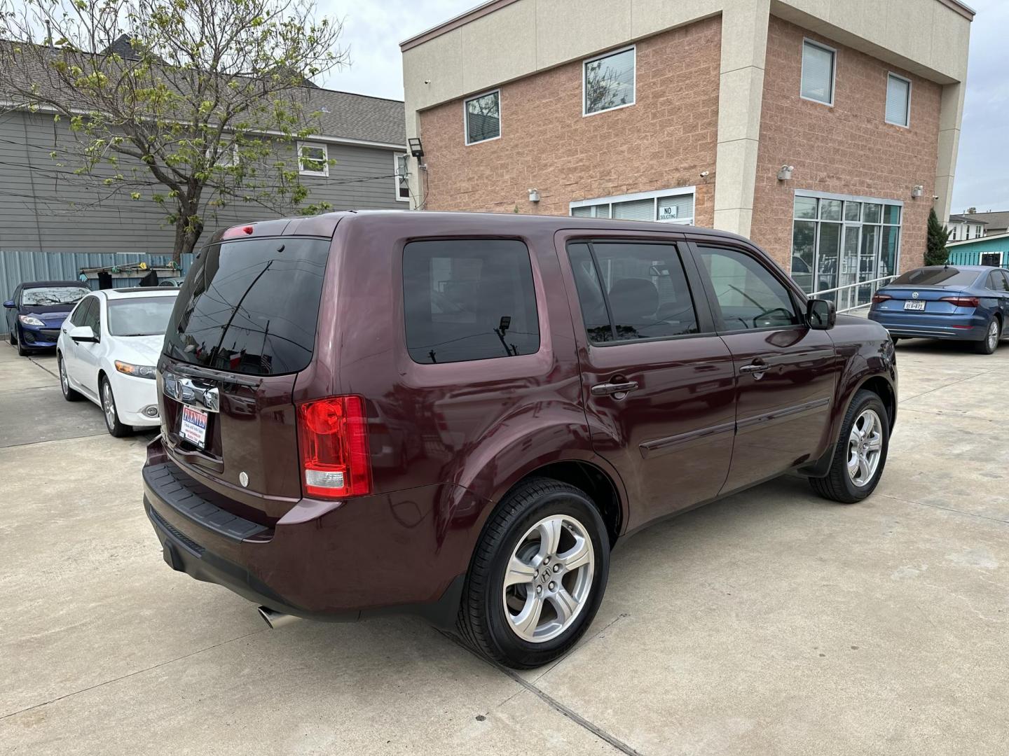 2014 Maroon /Black Honda Pilot EX-L 2WD 5-Spd AT (5FNYF3H58EB) with an 3.5L V6 SOHC 24V engine, 5-Speed Automatic transmission, located at 1501 West 15th St., Houston, 77008, (713) 869-2925, 29.797941, -95.411789 - Photo#2