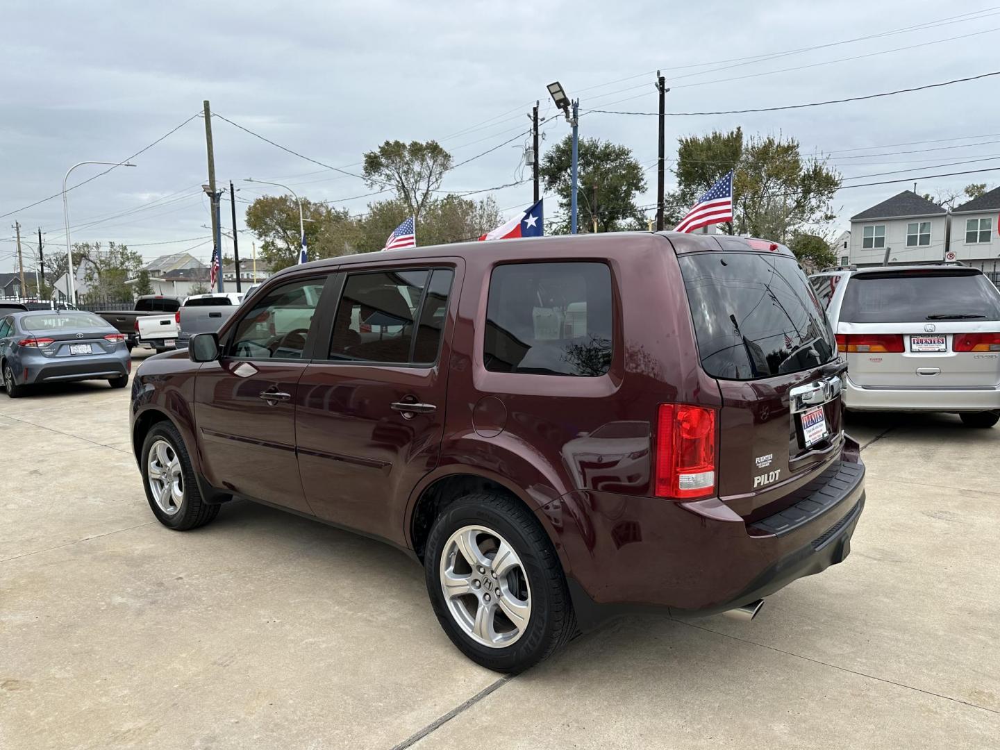 2014 Maroon /Black Honda Pilot EX-L 2WD 5-Spd AT (5FNYF3H58EB) with an 3.5L V6 SOHC 24V engine, 5-Speed Automatic transmission, located at 1501 West 15th St., Houston, 77008, (713) 869-2925, 29.797941, -95.411789 - Photo#4