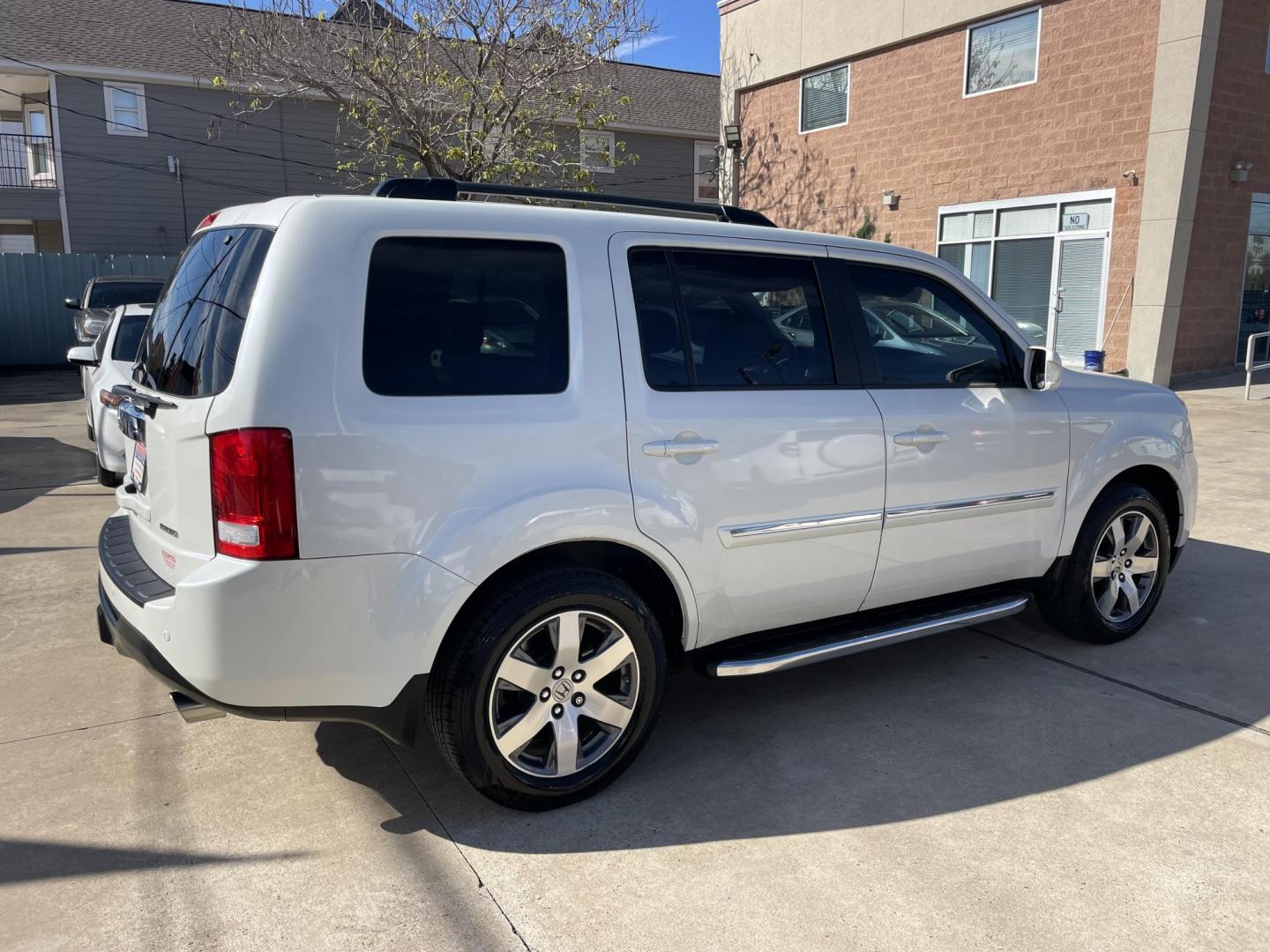 2014 White /Silver Honda Pilot Touring 2WD 5-Spd AT with DVD (5FNYF3H90EB) with an 3.5L V6 SOHC 24V engine, 5-Speed Automatic transmission, located at 1501 West 15th St., Houston, 77008, (713) 869-2925, 29.797941, -95.411789 - Photo#2