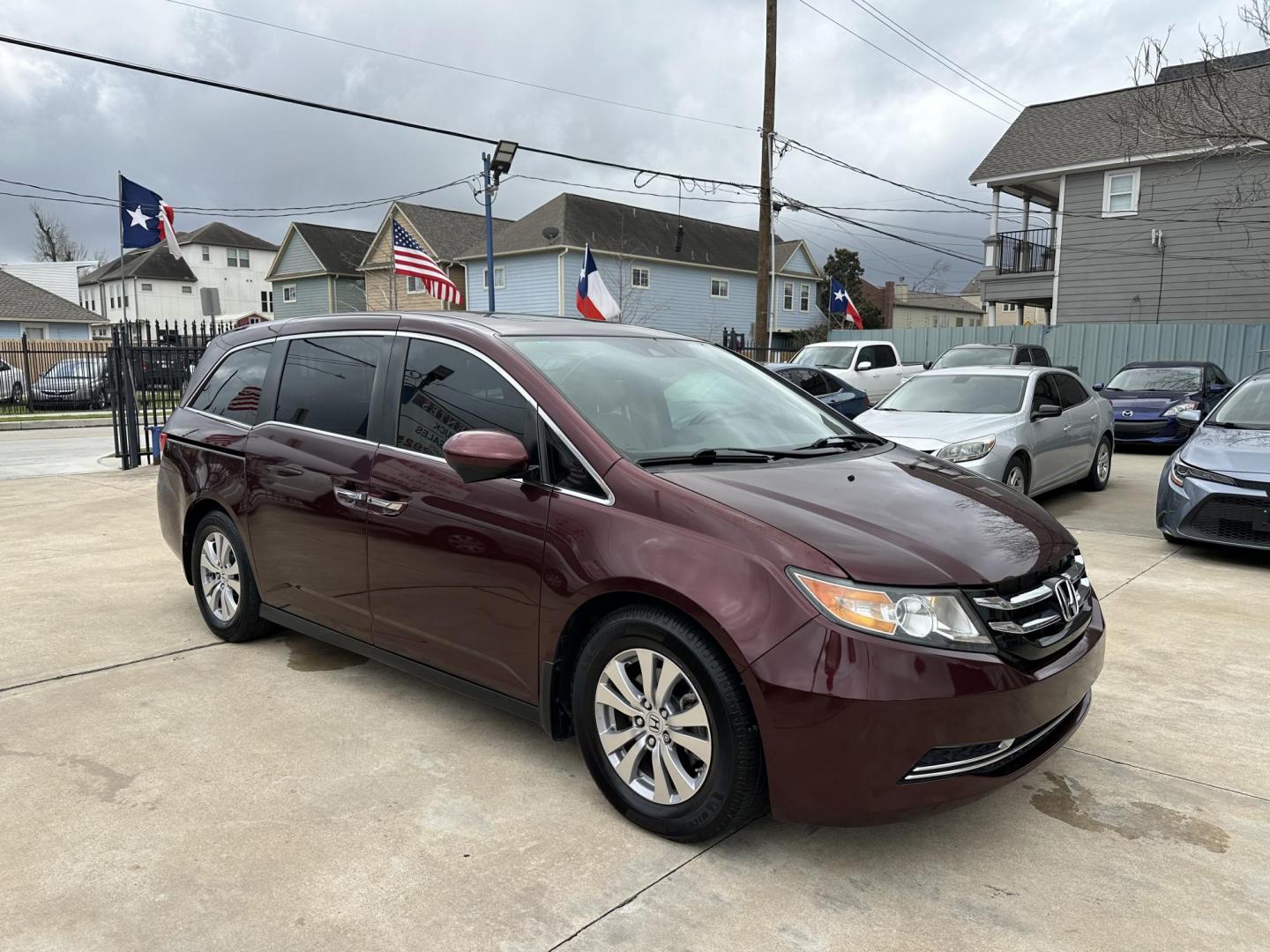 2017 Maroon /Silver Honda Odyssey EX-L w/Navigation (5FNRL5H68HB) with an 3.5L V6 SOHC 24V engine, 6A transmission, located at 1501 West 15th St., Houston, 77008, (713) 869-2925, 29.797941, -95.411789 - Photo#1