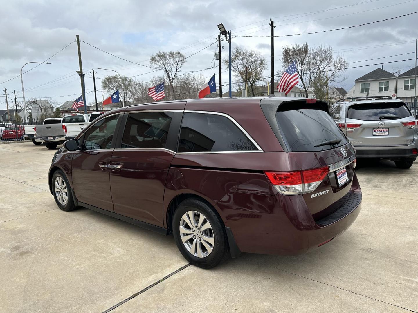 2017 Maroon /Silver Honda Odyssey EX-L w/Navigation (5FNRL5H68HB) with an 3.5L V6 SOHC 24V engine, 6A transmission, located at 1501 West 15th St., Houston, 77008, (713) 869-2925, 29.797941, -95.411789 - Photo#3