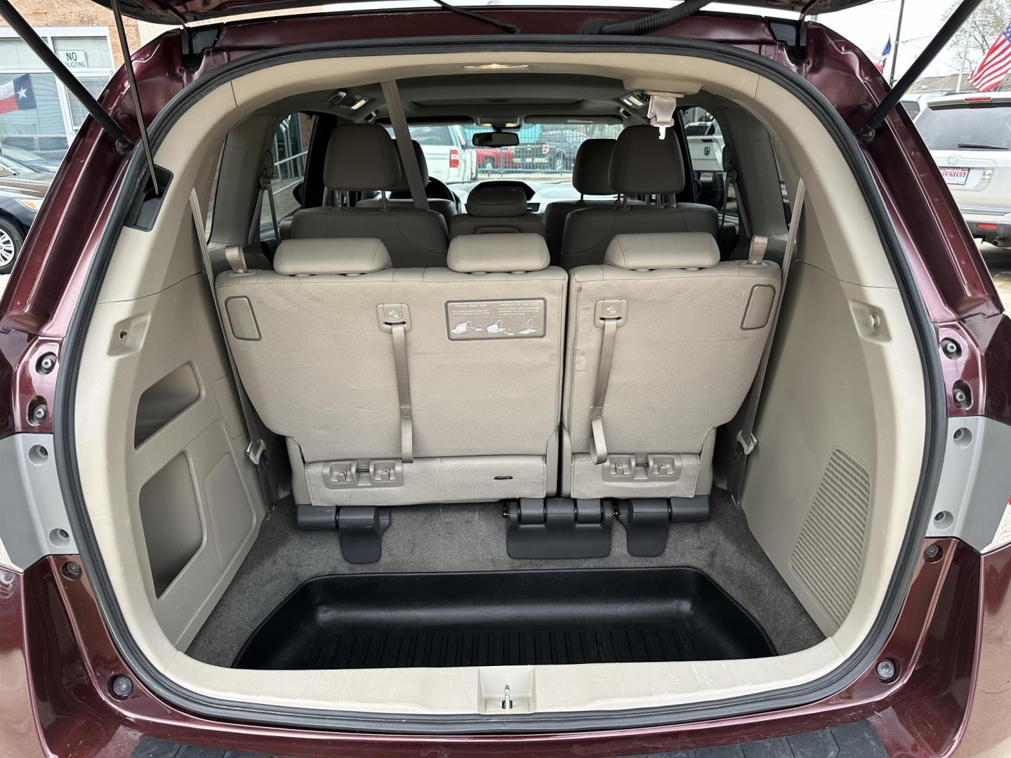 2017 Maroon /Silver Honda Odyssey EX-L w/Navigation (5FNRL5H68HB) with an 3.5L V6 SOHC 24V engine, 6A transmission, located at 1501 West 15th St., Houston, 77008, (713) 869-2925, 29.797941, -95.411789 - Photo#4