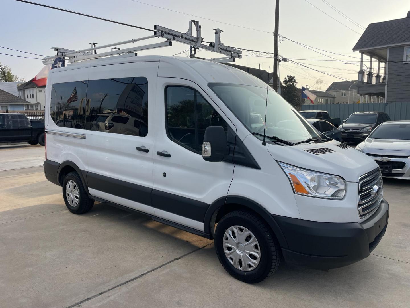 2018 White /Black Ford Transit 150 Wagon Med. Roof XLT w/Sliding Pass. 130-in. WB (1FDZK1CM5JK) with an 3.7L V6 DOHC 24V engine, 6A transmission, located at 1501 West 15th St., Houston, 77008, (713) 869-2925, 29.797941, -95.411789 - Photo#1