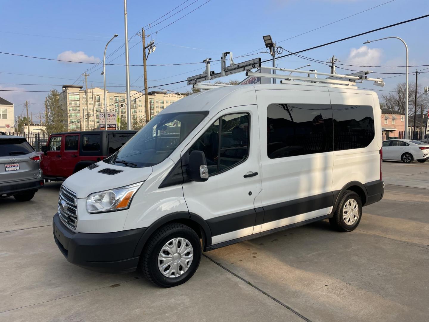 2018 White /Black Ford Transit 150 Wagon Med. Roof XLT w/Sliding Pass. 130-in. WB (1FDZK1CM5JK) with an 3.7L V6 DOHC 24V engine, 6A transmission, located at 1501 West 15th St., Houston, 77008, (713) 869-2925, 29.797941, -95.411789 - Photo#0