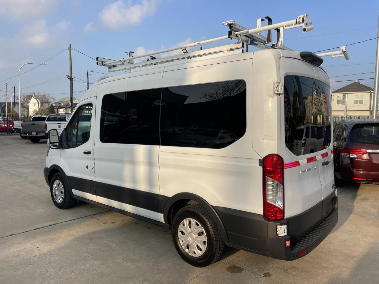 2018 White /Black Ford Transit 150 Wagon Med. Roof XLT w/Sliding Pass. 130-in. WB (1FDZK1CM5JK) with an 3.7L V6 DOHC 24V engine, 6A transmission, located at 1501 West 15th St., Houston, 77008, (713) 869-2925, 29.797941, -95.411789 - Photo#3